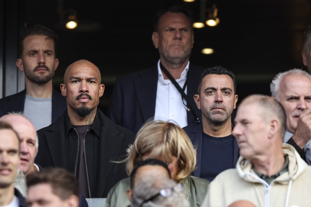Nigel de Jong en Xavi Hernández