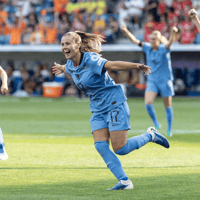 De Oranje Leeuwinnen vieren een doelpunt
